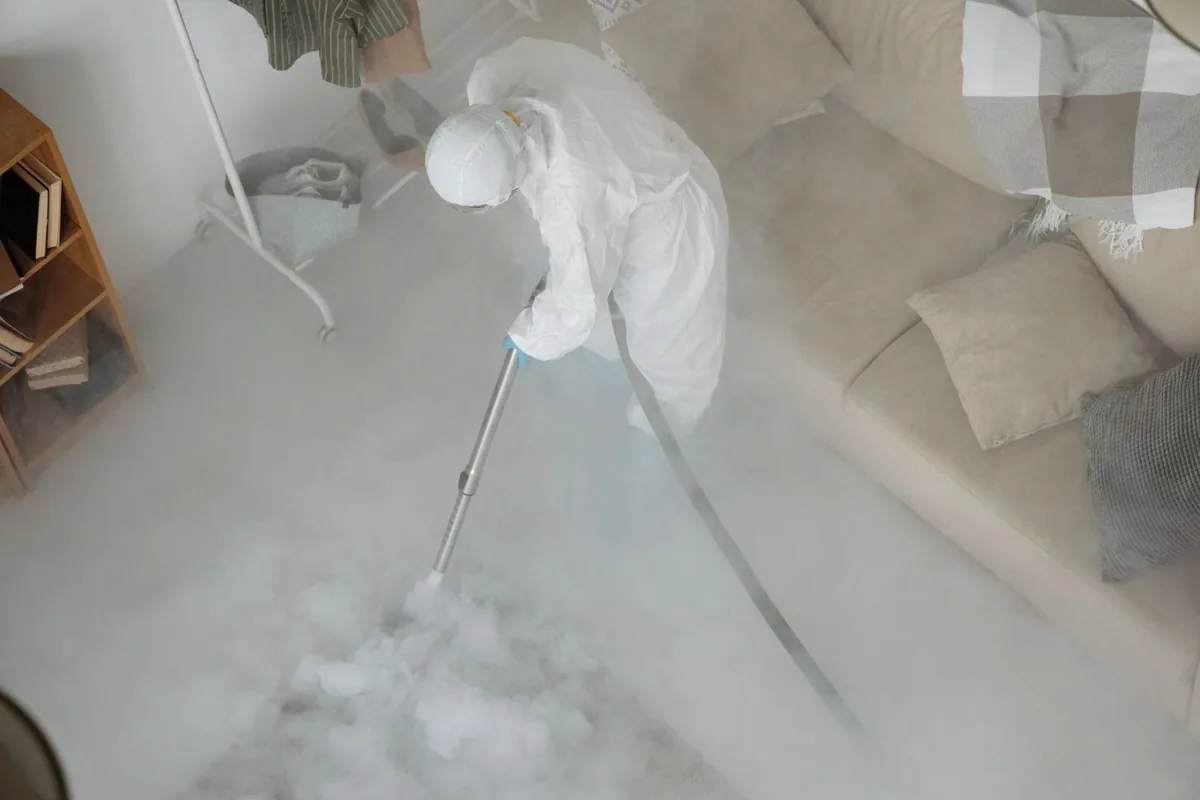 Biohazard cleanup technician in protective equipment, Vaiden, MS